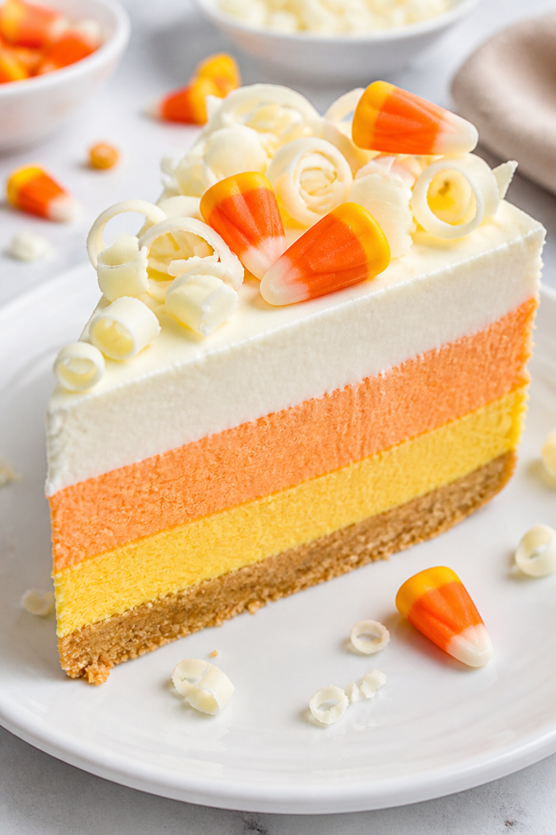 Layered Candy Corn Cheesecake Slice