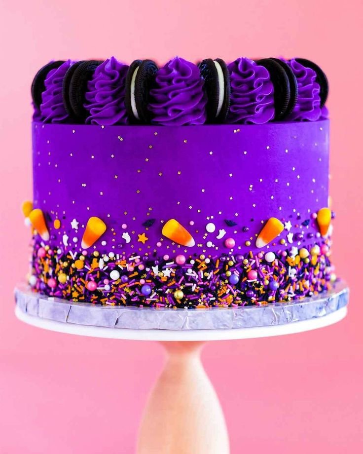 Purple Halloween Themed Cake with Sprinkles and Black Forks | Purple halloween cake, Colorful halloween cake designs, Halloween themed cake with colorful frosting