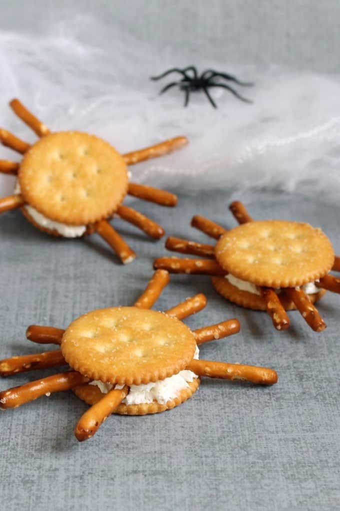 CRACKER SPIDERS Healthy Halloween treats for kids. These Halloween snacks and treats have less sugar, but are still fun … | Halloween snack for preschoolers, Halloween snacks toddlers, Halloween food treats