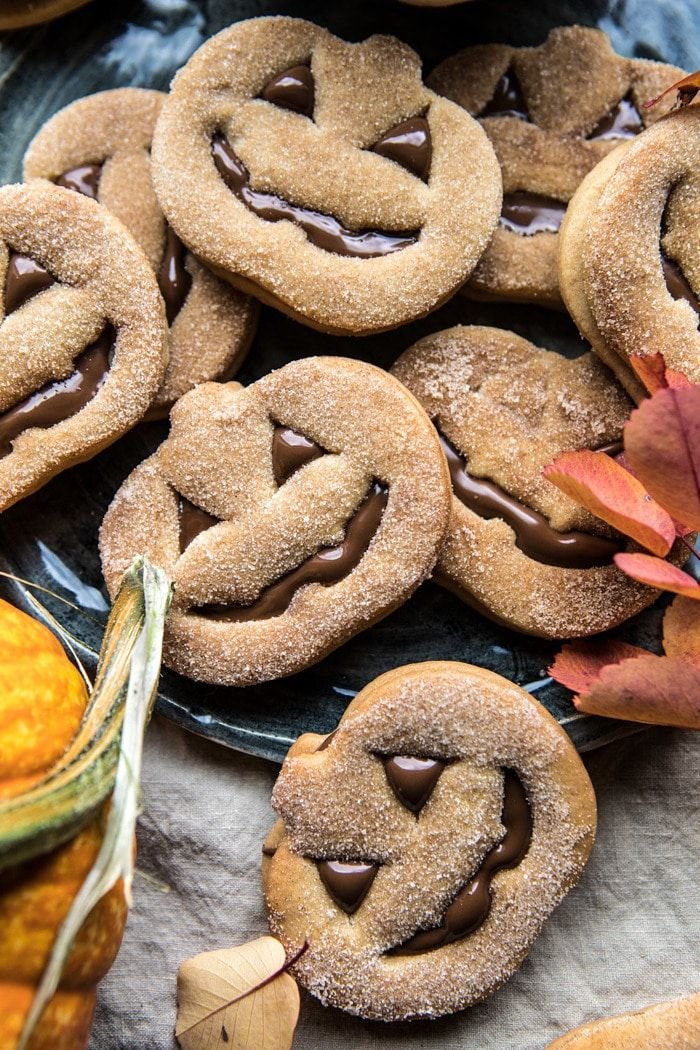 Milk Chocolate Stuffed Jack-O'-Lantern Cookies | Autumn baking ideas, Fall themed dessert, Halloween pumpkin cookies