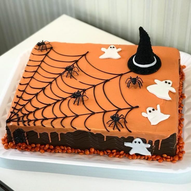 40th Halloween Birthday Cake with Ghosts, Spiders, Cats, Bats, Webs, and Jack-o-Lanterns | Diy spooky cake decoration, Halloween party cake ideas, Halloween-themed orange cake