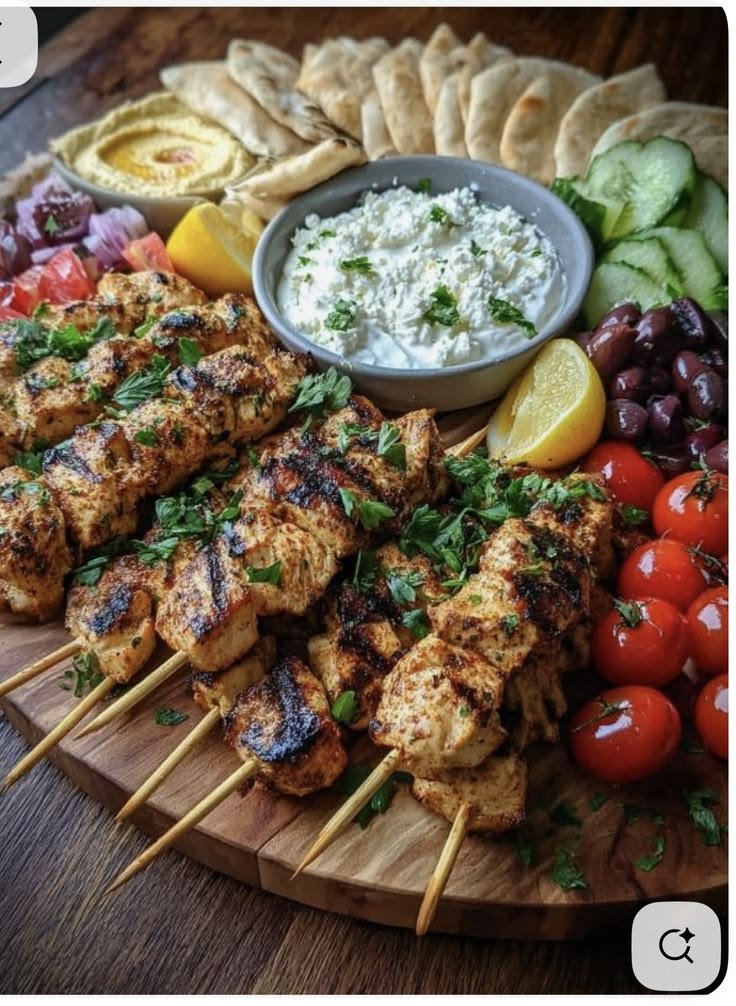 Serving grilled chicken skewers | Chicken kebabs with sides, Greek chicken souvlaki, Party food platters