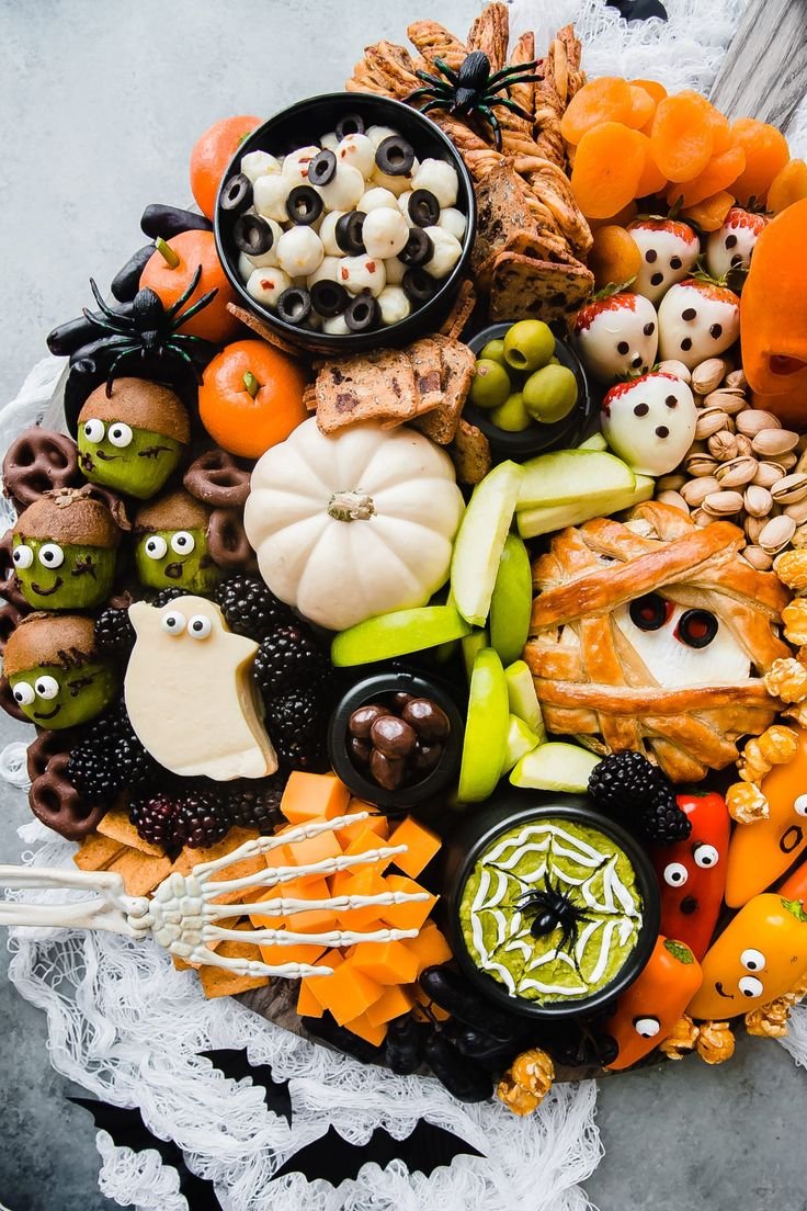 Spooky and Delicious Halloween Party Recipes | Healthy halloween charcuterie board, Halloween movie night charcuterie board, Halloween snack board