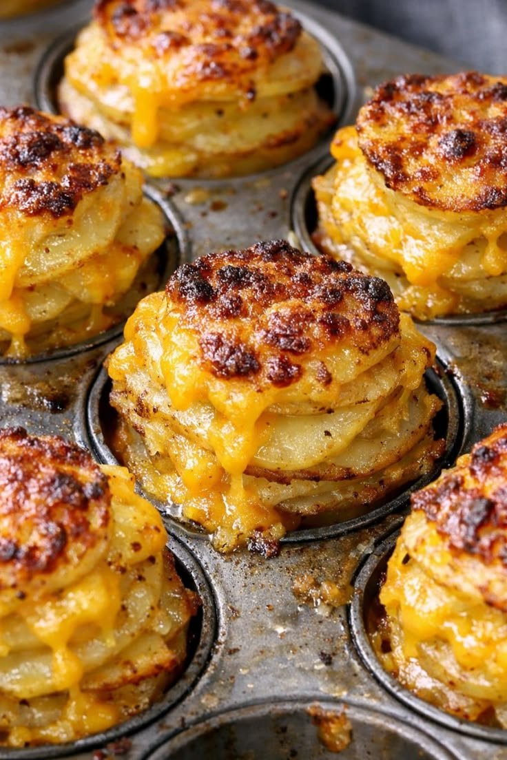 My sister shared this 4 ingredient layered side dish and the crispy edges are absolutely incredible | Baked cheddar potatoes, Cheesy stacks oven baked, Oven-baked 4-ingredient cheesy potato stacks