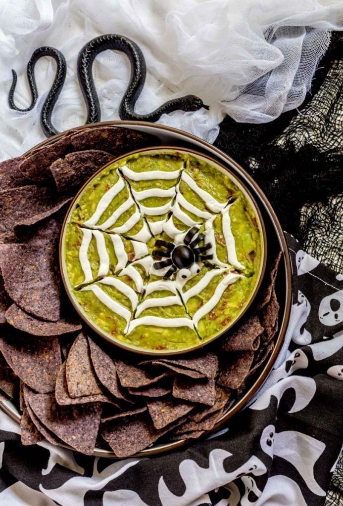 Halloween Guacamole Spiderweb and Witch Appetizers | Spooky appetizers for halloween, Halloween appetizers for party, Spider web guacamole