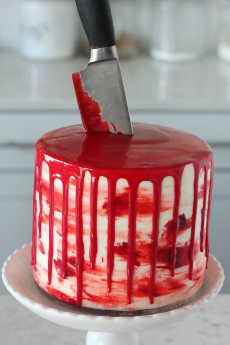 Blood-Drip Halloween Cake with Red Velvet and Almond Cream Cheese Frosting | Easy horror cakes, Slasher cake ideas, Halloween themed cake with knives