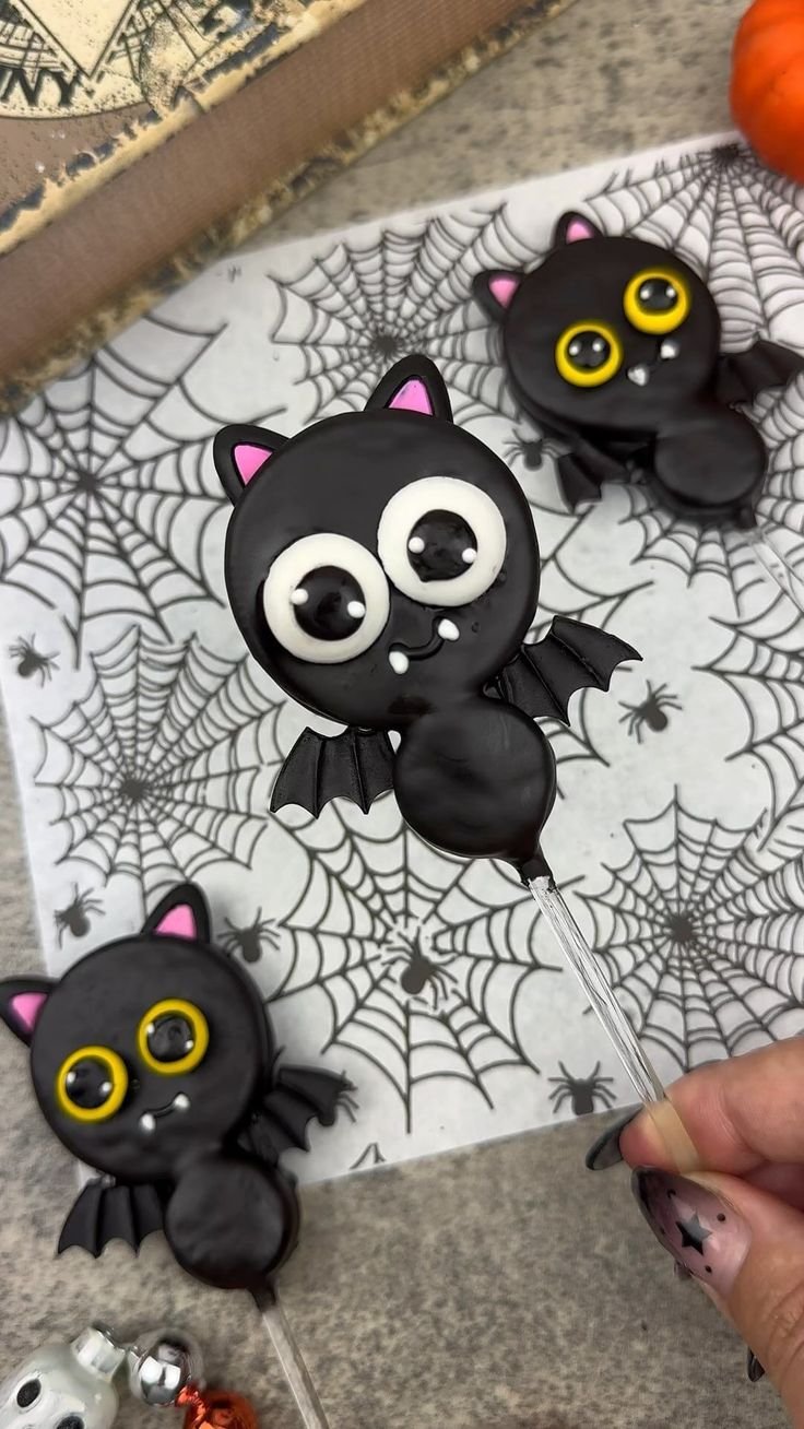Bats made out of oreos | Oreo ball bats, Halloween cake pops, Halloween treats easy