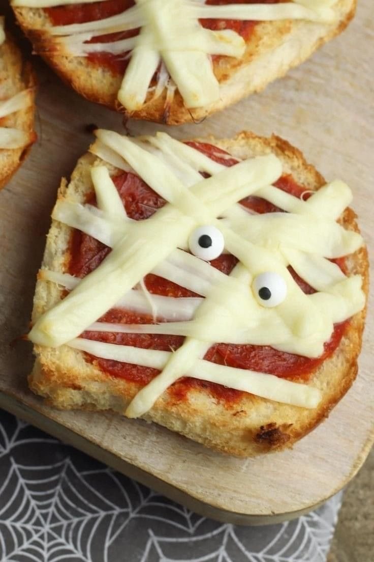 Spooky Mummy Pizza for a Fun Halloween Treat! | Halloween meal recipes, Halloween lunch for kids, Spooky lunch for kids