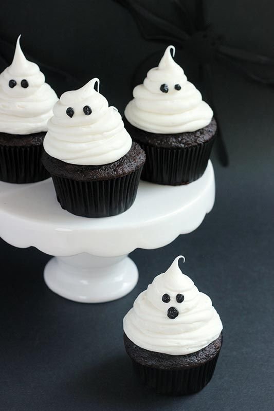 Easy Halloween Ghost Cupcakes | Ghost cupcakes for kids, Halloween ghost cupcake decorating ideas, Ghost cupcakes with white frosting