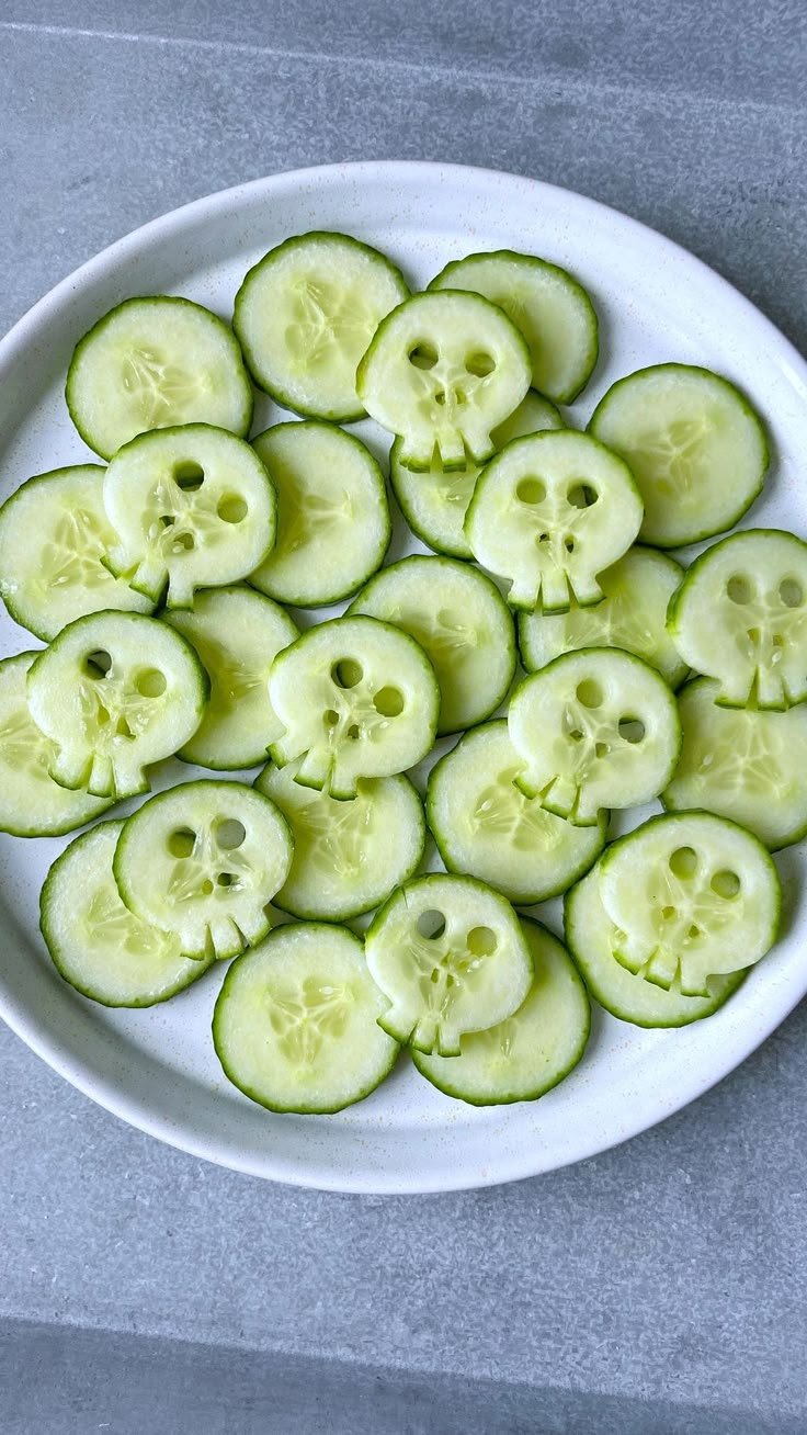 Cucumber Skulls | Healthy Halloween Snacks | Halloween cucumber ideas, Halloween food ideas, Fun halloween food