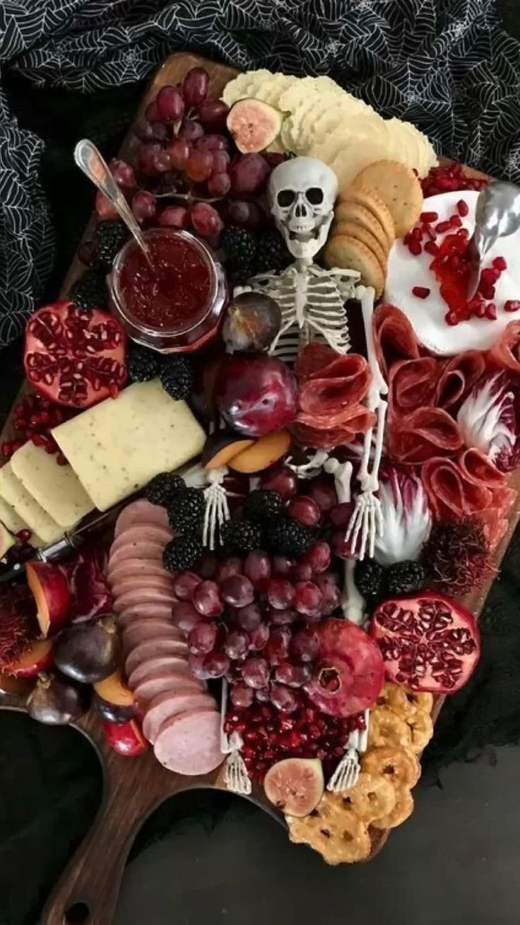 Spooky Halloween Dinner Party Ideas | Skeleton charcuterie table, Spooky charcuterie board skeleton, Halloween food for party