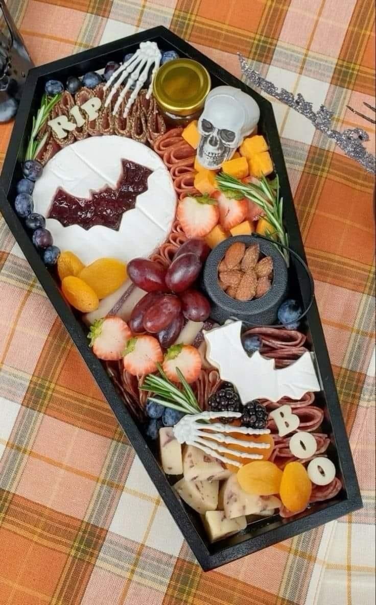 Spooky Coffin Charcuterie | Diy spooky charcuterie board, Fall plaid table decor, Halloween party snack ideas
