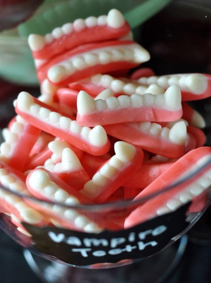 Vampire Teeth Candy in Apothecary Jar for Halloween | Halloween vampire party food, Vampire party snacks, Vampire dentures