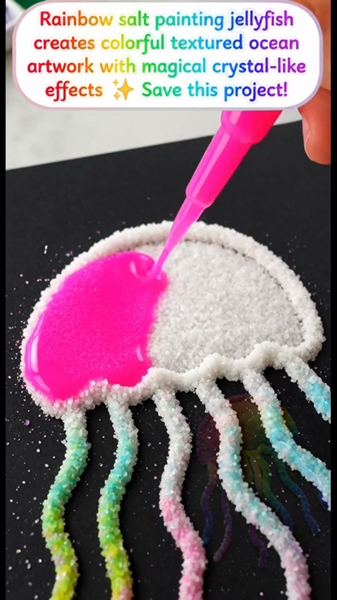 The jellyfish painting with rainbow salt produces vibrant, textured ocean art that features enchanting crystal-like effects. Be sure to save this project!