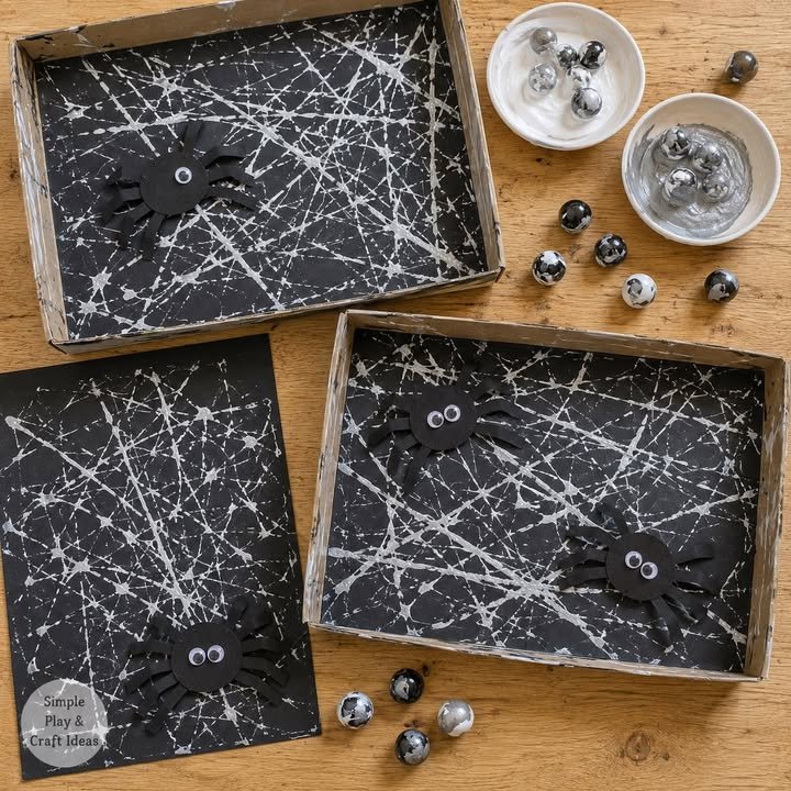 🕷️🎨 Marble-Painted Spider Webs!

Pop black card into a shallow tray, dip marbles in white and silver paint, then roll them around to create wonderfully tangled webs. Once dry, add a friendly eight-le...