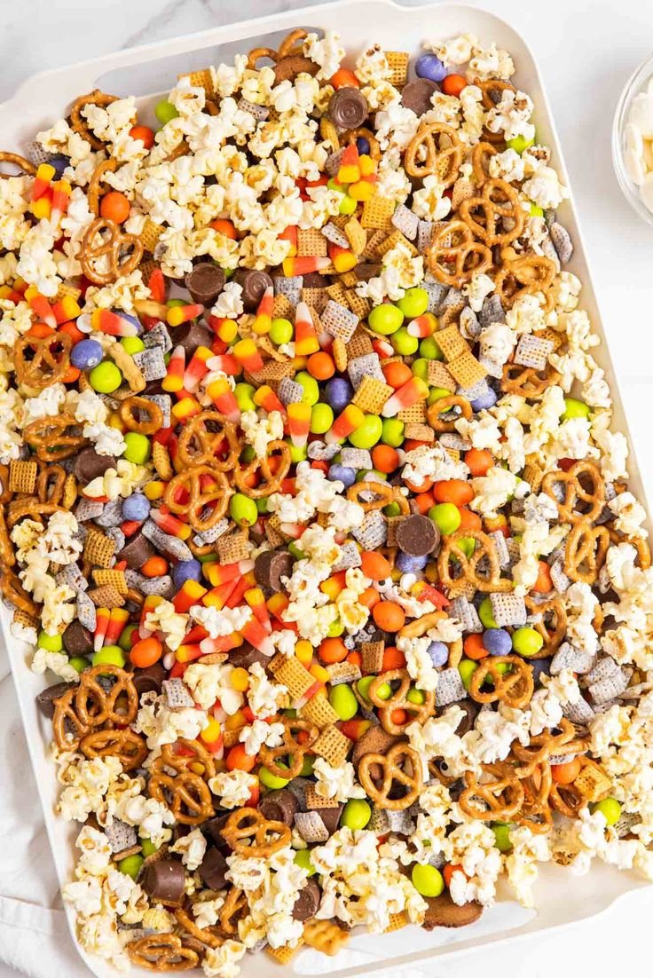 Sweet, salty, and crunchy Halloween Snack Mix made with easy-to-find ingredients. Salty and sweet snacks are combined to… | Sweet and salty halloween snack mix, Halloween chex mix white chocolate, Snack mix with bugles and candy corn