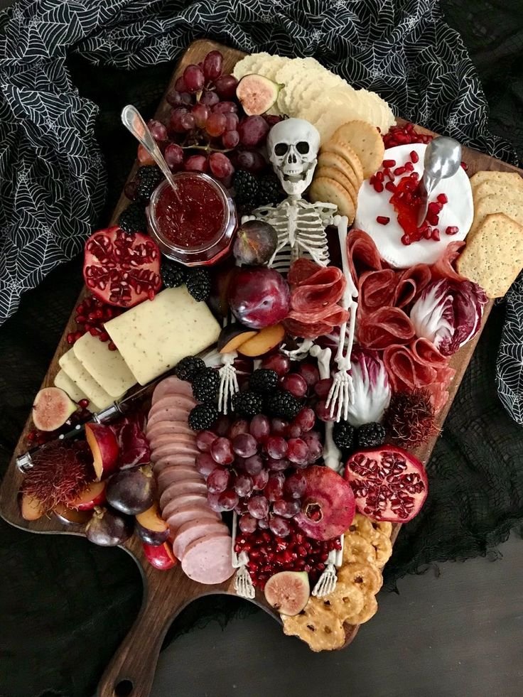 Spooky Halloween Dinner Party Ideas | Skeleton charcuterie table, Spooky charcuterie board skeleton, Halloween food for party