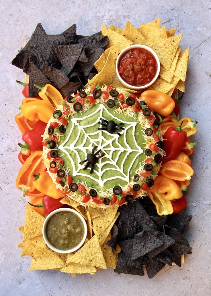 Spooky Halloween Boards for a Frightfully Fun Party | Spider web taco dip, Halloween food for party, Halloween food ideas