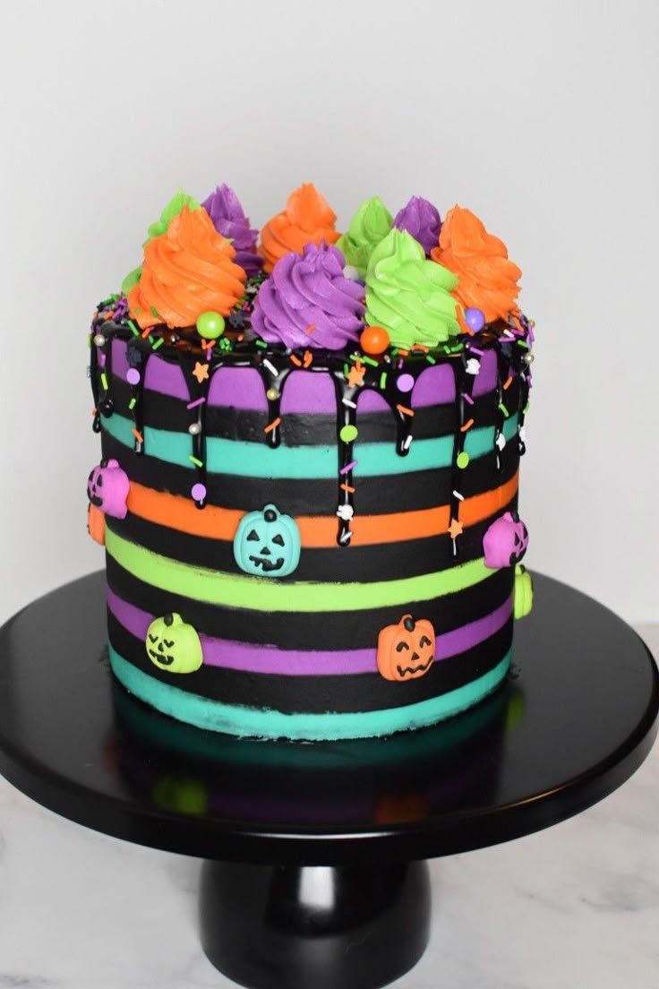 Halloween rainbow cake | Colorful halloween cake designs, Colorful halloween cake decoration, Halloween cake ideas