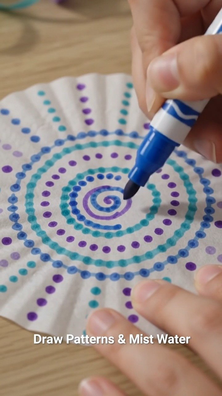 Coffee filters transform into colorful jellyfish that gently sway from a handmade mobile inspired by the ocean. 9 Coffee filters transform into colorful jellyfish that gently sway from a handmade mobile inspired by the ocean.